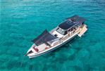 Chaser 54 Laguna - 2023 Chaser 54 Laguna yacht on clear turquoise water, featuring sleek design and sunshades.