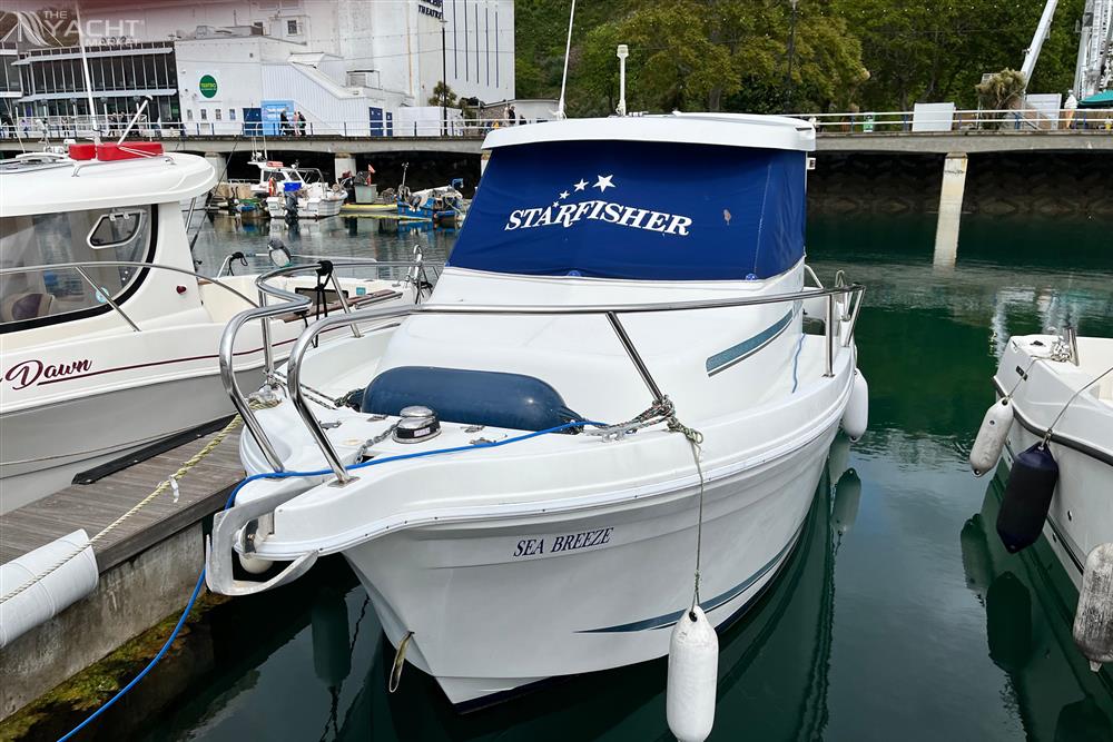 Starfisher 670 - 2001 Starfisher 670 boat named &quot;Sea Breeze&quot; docked in a marina.