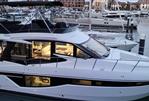 Galeon 460 Fly - Luxury 2022 Galeon 460 Fly yacht docked at marina during sunset.