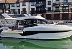 Galeon 460 Fly - 2022 Galeon 460 Fly yacht docked near modern waterfront buildings.