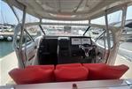 Nimbus T11 T-TOP - Interior view of 2022 Nimbus T11 T-TOP boat with red seats and modern dashboard.