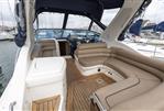 Sealine S34 - 2004 Sealine S34 yacht interior with beige seating and wooden flooring.