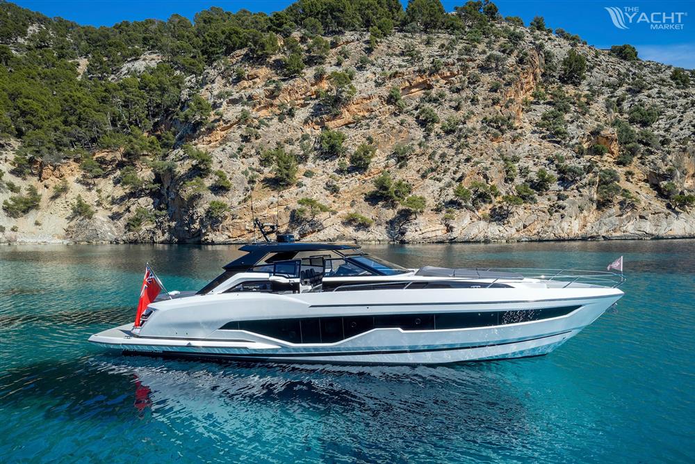 Sunseeker Superhawk 55 - 2024 Sunseeker Superhawk 55 yacht cruising near rocky coastline.
