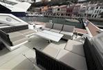 Sunseeker Superhawk 55 - Luxurious 2024 Sunseeker Superhawk 55 yacht deck with elegant seating and waterfront view.