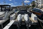 Nimbus T11 T-TOP - 2022 Nimbus T11 T-TOP boat docked in a marina, featuring dual outboard engines.