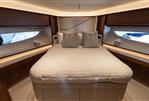 Princess S78 - Luxurious bedroom interior of 2022 Princess S78 yacht with elegant wood finishes.