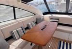 Princess V53 - Luxurious 2006 Princess V53 yacht interior with elegant seating and wooden table.