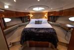 Princess V53 - Luxurious cabin interior of 2006 Princess V53 yacht with cozy bed and elegant lighting.