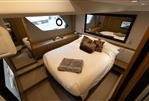 Princess V52 - Luxurious bedroom interior of 2014 Princess V52 yacht with elegant bedding and modern design.