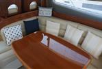 Princess 42 - Luxurious interior of 2006 Princess 42 Flybridge Motor Yacht with elegant seating and cushions.