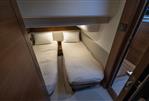 Princess 43 - Twin beds in a 2018 Princess 43 yacht cabin, featuring cozy bedding and modern design.