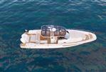 Nimbus Tender 12 - Luxurious 2026 Nimbus Tender 12 yacht cruising on clear blue waters.