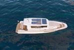 Nimbus Commuter 12 - Aerial view of 2026 Nimbus Commuter 12 boat with solar panels on blue water.