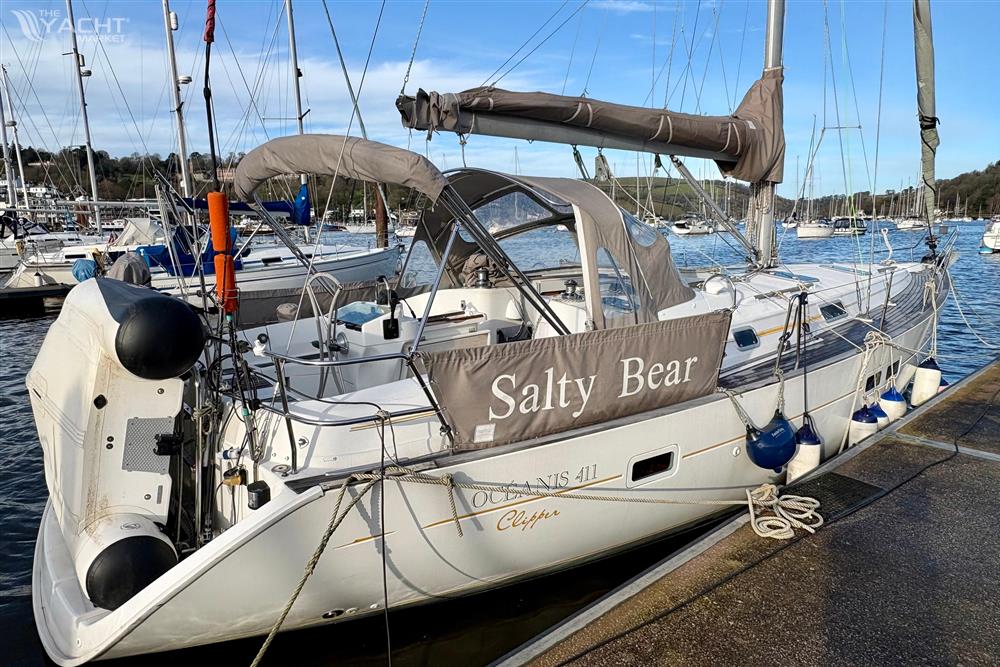 Beneteau Oceanis Clipper 411 - 1999 Beneteau Oceanis Clipper 411 sailboat docked, named "Salty Bear," with marina background.