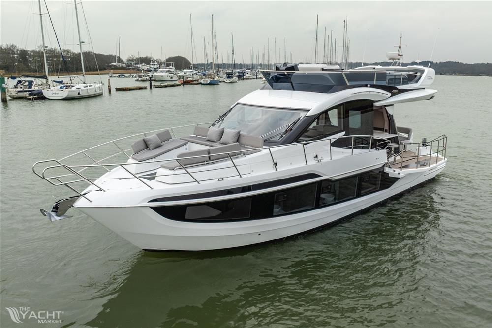 Galeon 480 Fly - 2025 Galeon 480 Fly yacht on calm water, featuring sleek design and spacious deck.