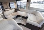 Galeon 480 Fly - Luxurious interior of 2025 Galeon 480 Fly yacht with elegant seating and table.