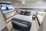 Galeon 480 Fly - Luxurious bedroom interior of 2025 Galeon 480 Fly yacht with modern design and cozy seating.