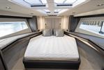 Galeon 480 Fly - Luxurious bedroom interior of 2025 Galeon 480 Fly yacht with skylights and modern design.