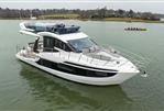 Galeon 480 Fly - 2025 Galeon 480 Fly yacht on calm water, showcasing sleek design and luxury features.