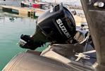 Brig Eagle 650 - 2019 Brig Eagle 650 with Suzuki outboard motor at marina dock.