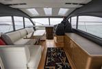 Princess V48 - Luxurious interior of 2014 Princess V48 yacht with seating and helm.